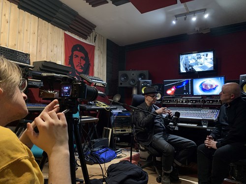 Josh is filming at a studio